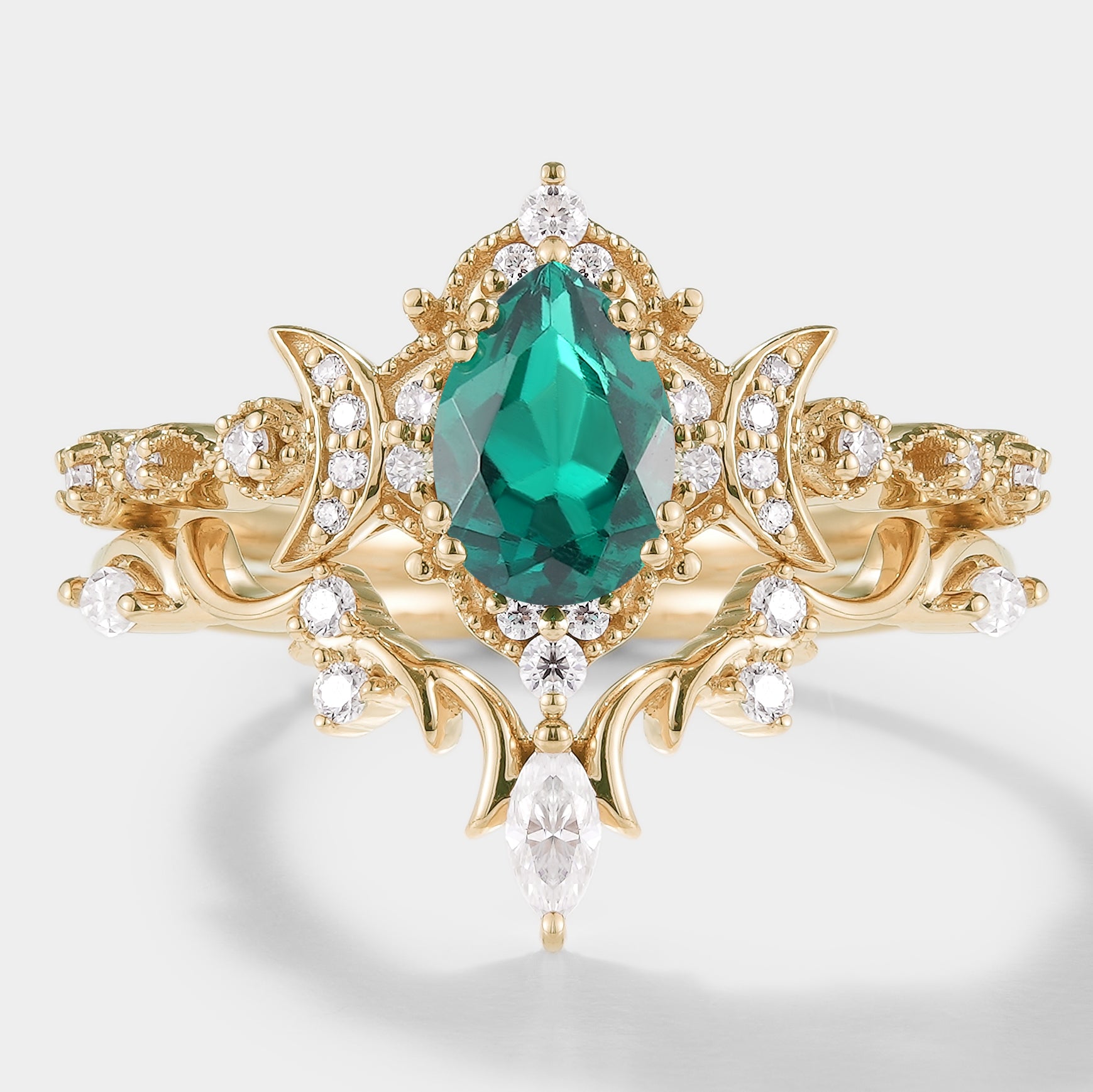 Emerald engagement ring set with moissanite, celestial design