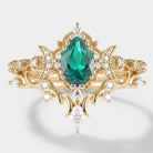 Emerald engagement ring set with moissanite, celestial design