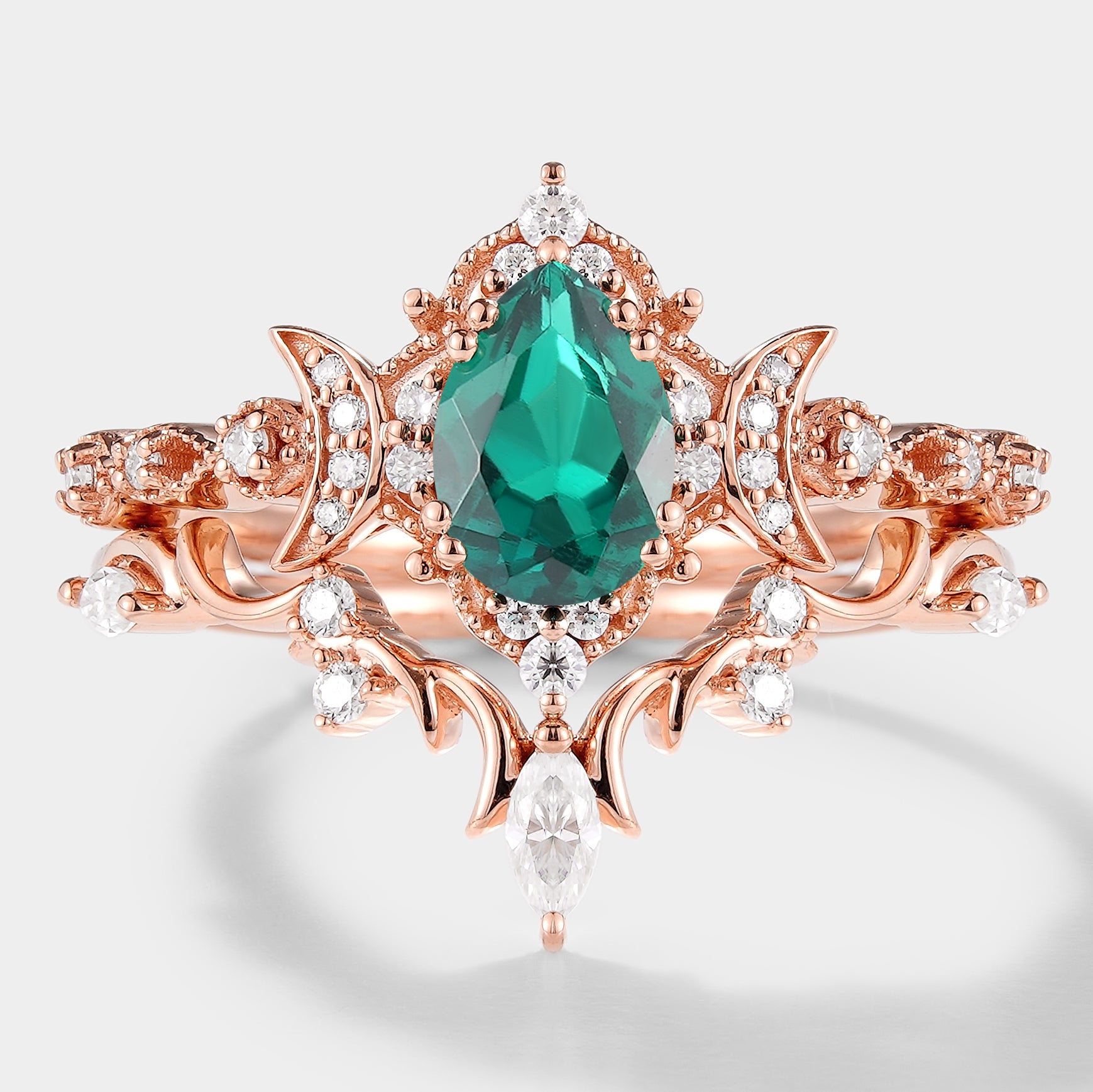 Emerald and moissanite engagement ring set