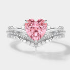 Heart-cut Padparadscha sapphire engagement ring set with leaf details