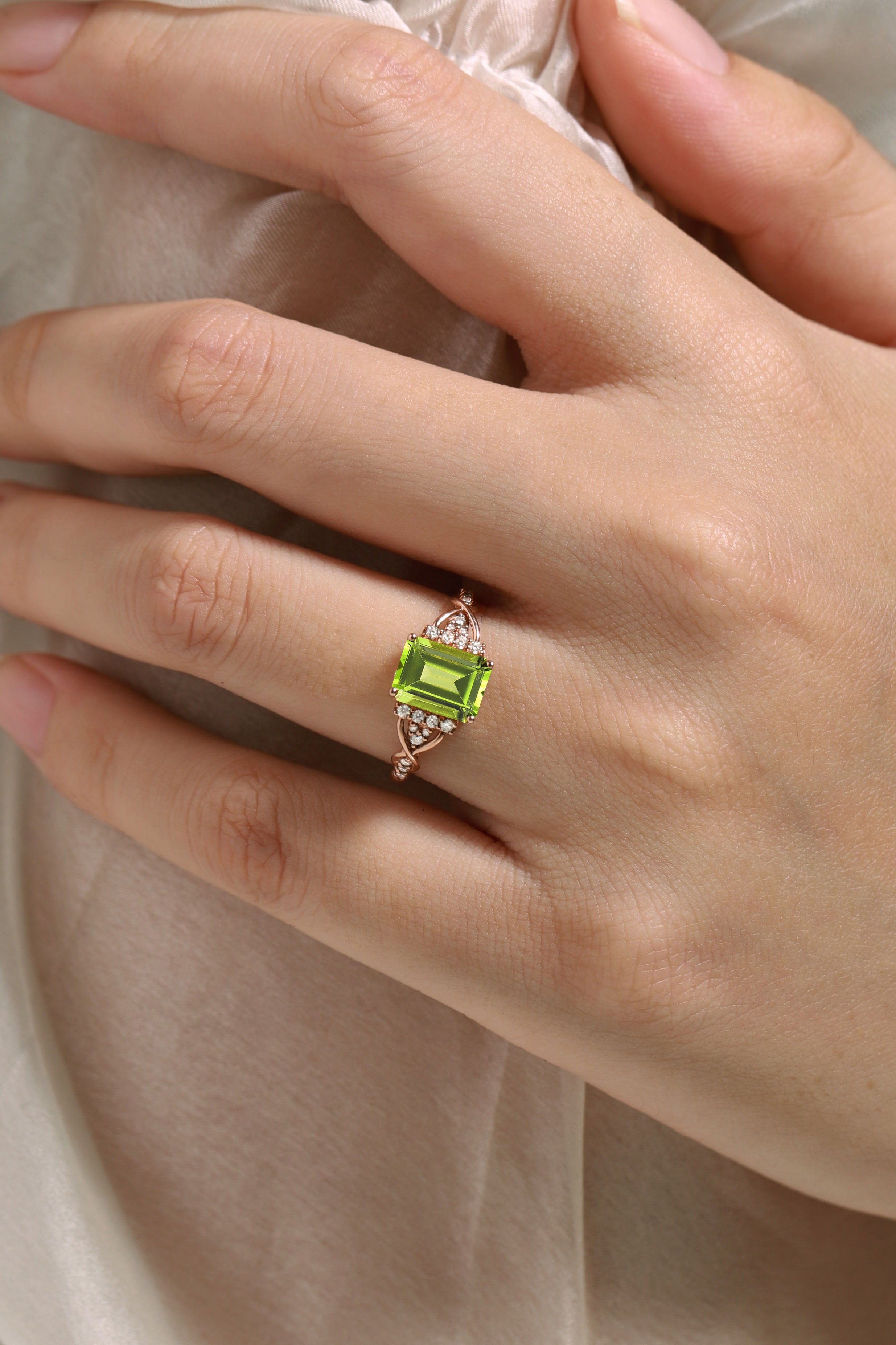 Emerald cut peridot engagement ring in rose gold, featuring moissanite accents, vintage design, handmade