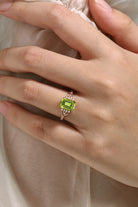 Emerald cut peridot engagement ring in rose gold, featuring moissanite accents, vintage design, handmade