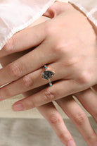 Vintage pear-cut black rutilated quartz engagement ring with turquoise accents in rose gold band.