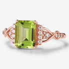 Emerald cut peridot engagement ring in rose gold with moissanite accents. Vintage style, bridal ring set.