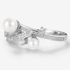 Pearl engagement ring with moissanite accents and unique design