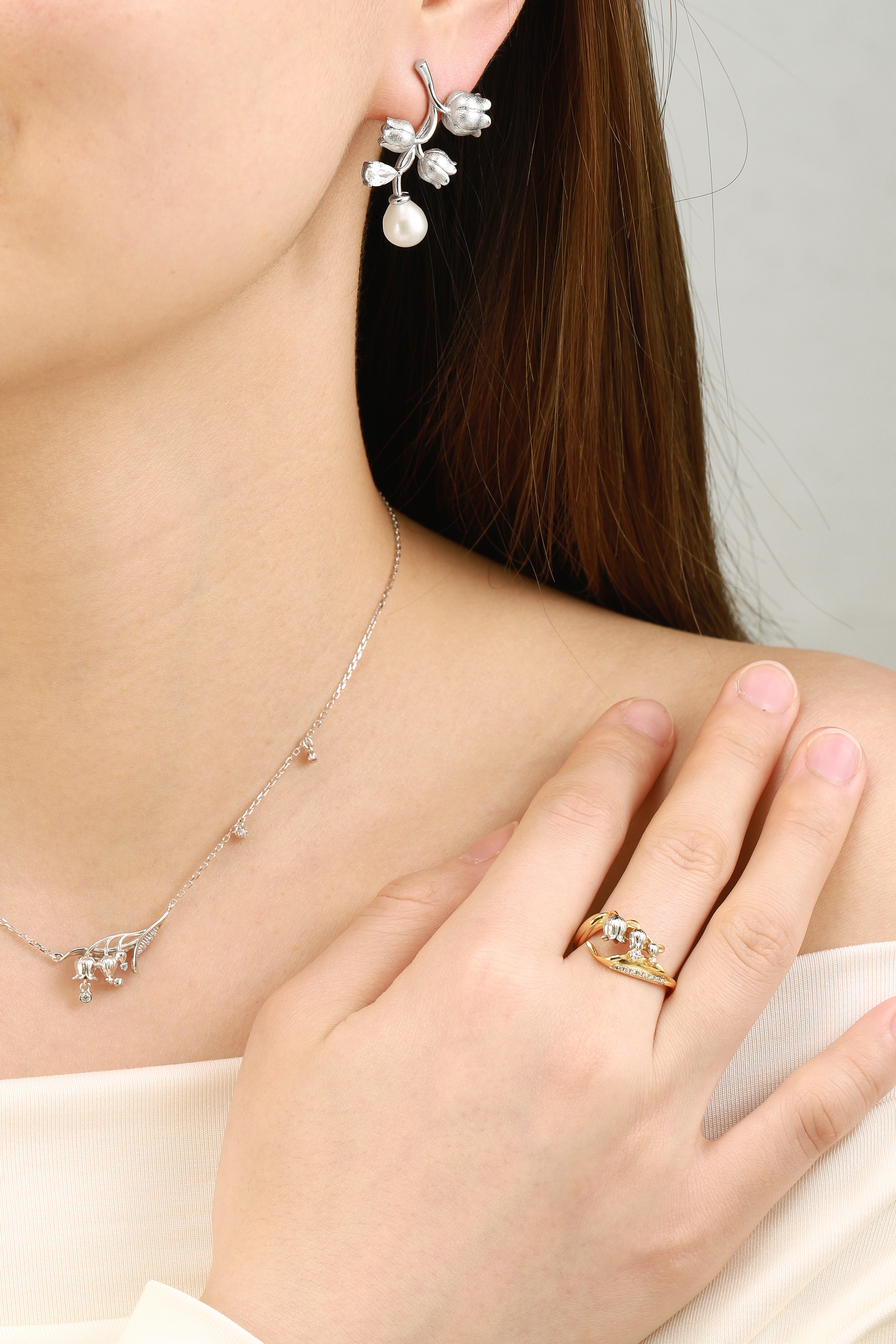 Lahela Jewelry: Nature-inspired Lily of the Valley jewelry set, gold ring, earrings, and necklace