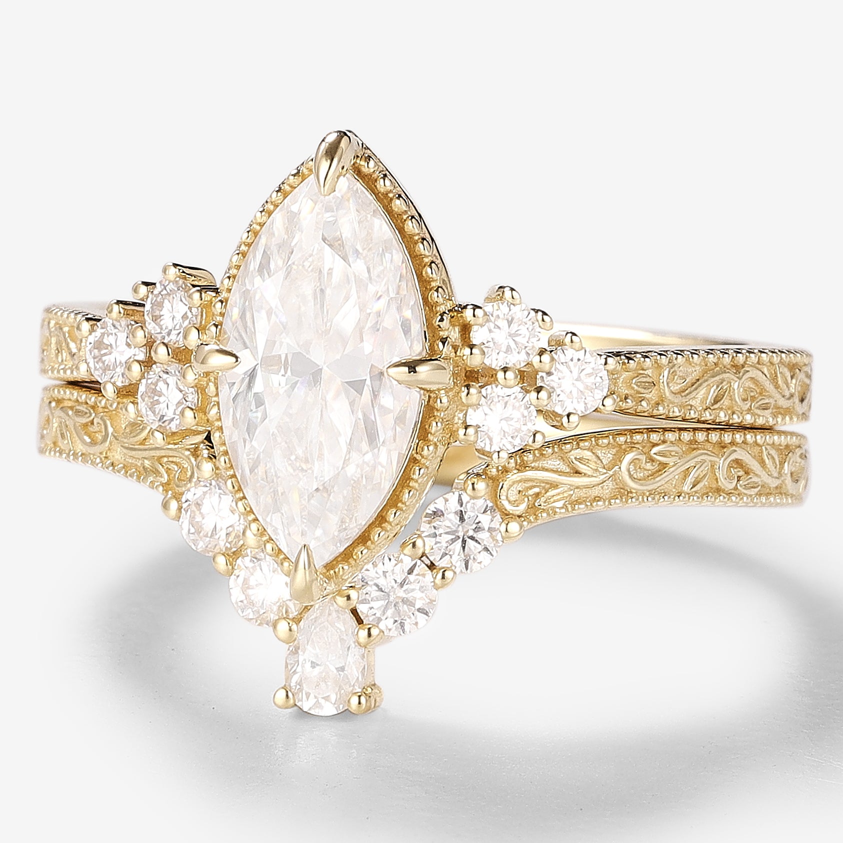 Vintage moissanite engagement ring set. Marquise cut center stone, yellow gold, Victorian style bridal set. Wedding rings.
