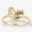Yellow gold engagement ring with kite cut green sapphire and marquise moissanite. Lahela Jewelry.