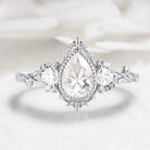 Nature-Inspired Pear Cut Moissanite Bezel Engagement Ring with Trillion Accent Stones - Emily