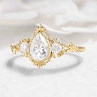Nature-Inspired Pear Cut Moissanite Bezel Engagement Ring with Trillion Accent Stones - Emily