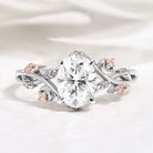Oval Moissanite engagement ring with leaf design and morganite side stones