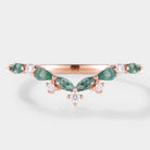 Curved wedding band with moss agate and diamond accents