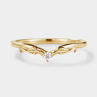 Yellow gold V-shaped moissanite wedding band with leaf design