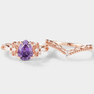 Nature-inspired pear-cut purple sapphire engagement ring set