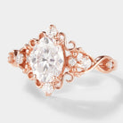 Rose gold vintage oval moissanite engagement ring. Classic design with halo and accent stones, bridal jewelry.