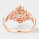 Rose gold vintage oval moissanite engagement ring. Bridal jewelry with unique details.