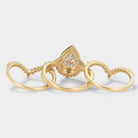 Gold pear cut halo moissanite ring set