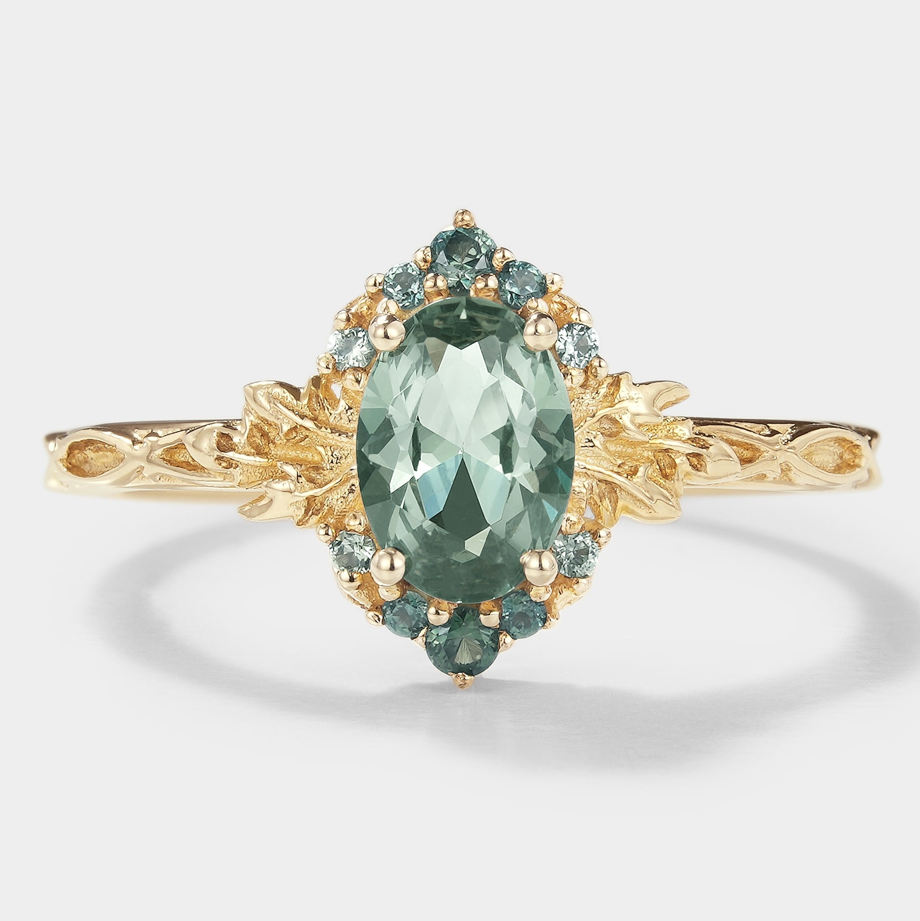 Oval Green Sapphire Engagement Ring with Leaf Pattern in Gold