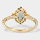 Back view of Saphira oval green sapphire engagement ring with leaf detailing in gold, bridal jewelry
