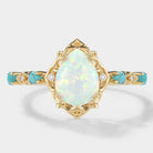 Pear-cut opal engagement ring with turquoise stones