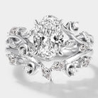 Oval lab grown diamond engagement ring with a curved moissanite wedding band