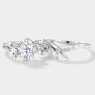 Oval moissanite engagement ring set with leaf and moon design