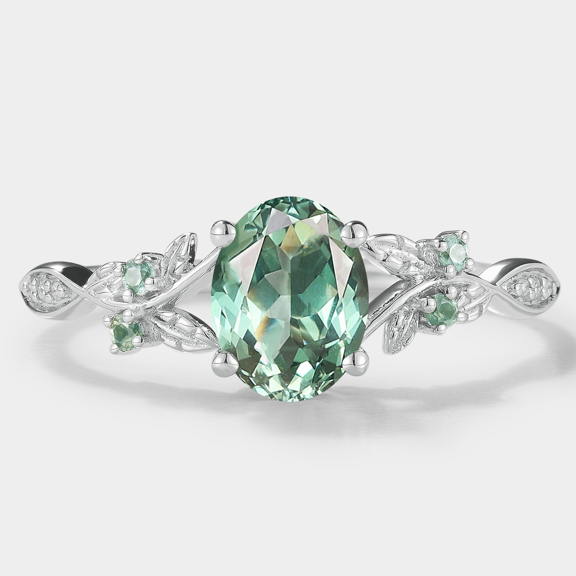 Nature-inspired green sapphire engagement ring with leaf detail