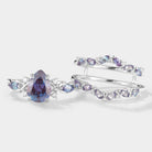 Pear cut Alexandrite engagement ring with enhancer band
