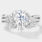 Oval moissanite engagement ring set with leaf accents