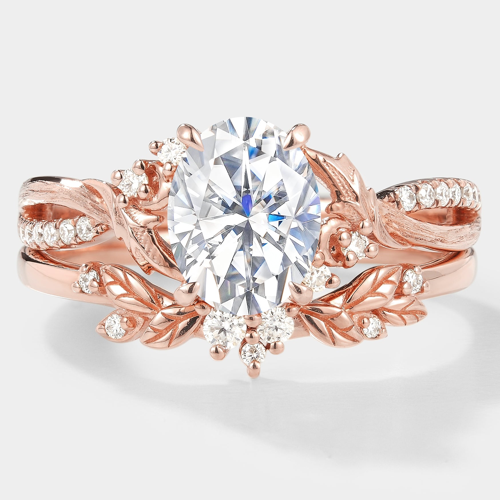 Rose gold moissanite ring set with leaf and floral design