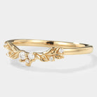 Gold leaf pattern wedding band with moissanite stones. Nature-inspired design