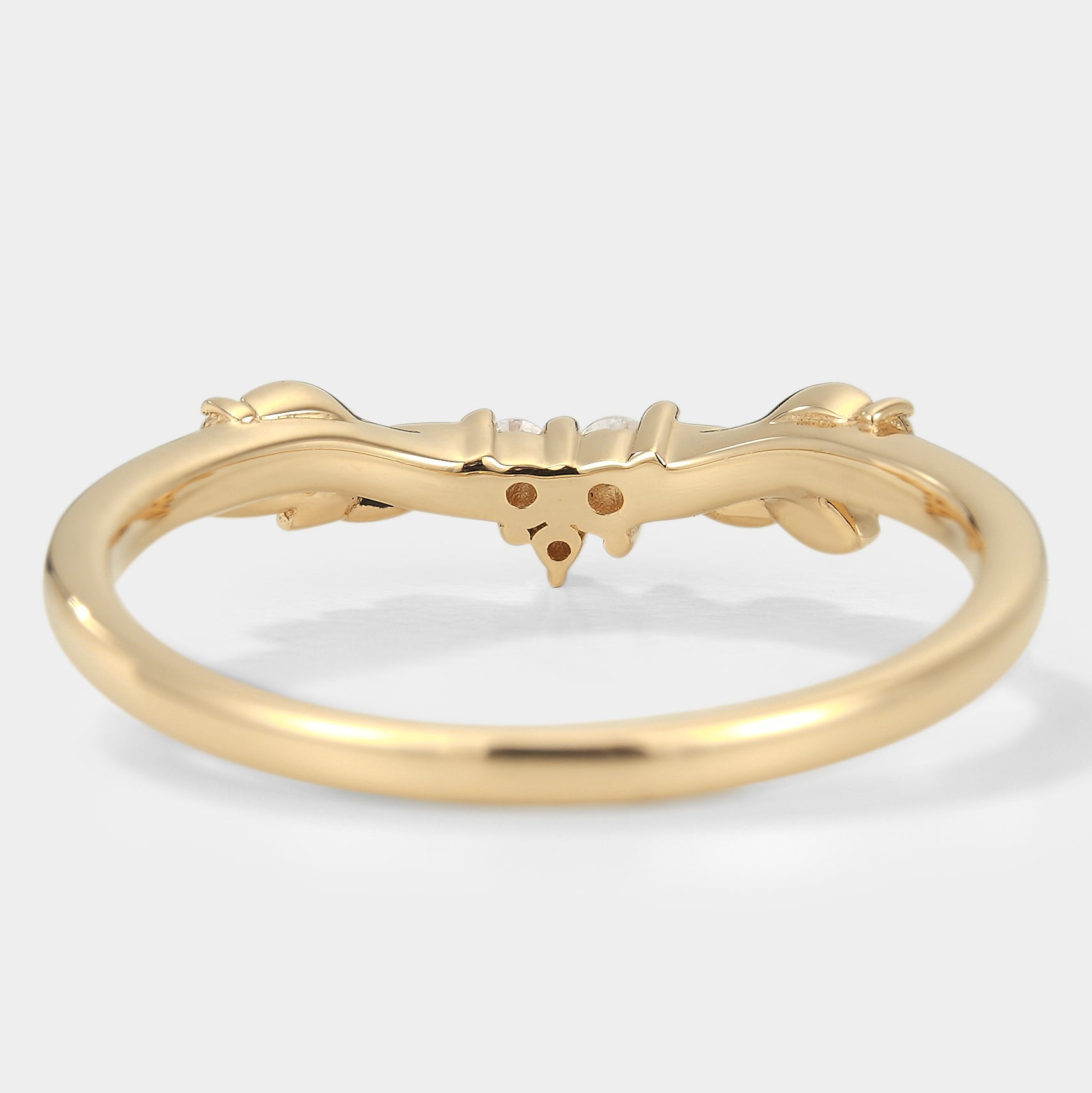 Gold leaf wedding band with moissanite, nature-inspired design