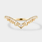 Gold chevron wedding band with heart accents and moissanite stones