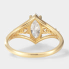 Marquise moissanite engagement ring in 14k gold, vintage style, with accent stones. Perfect for proposal or daily wear.