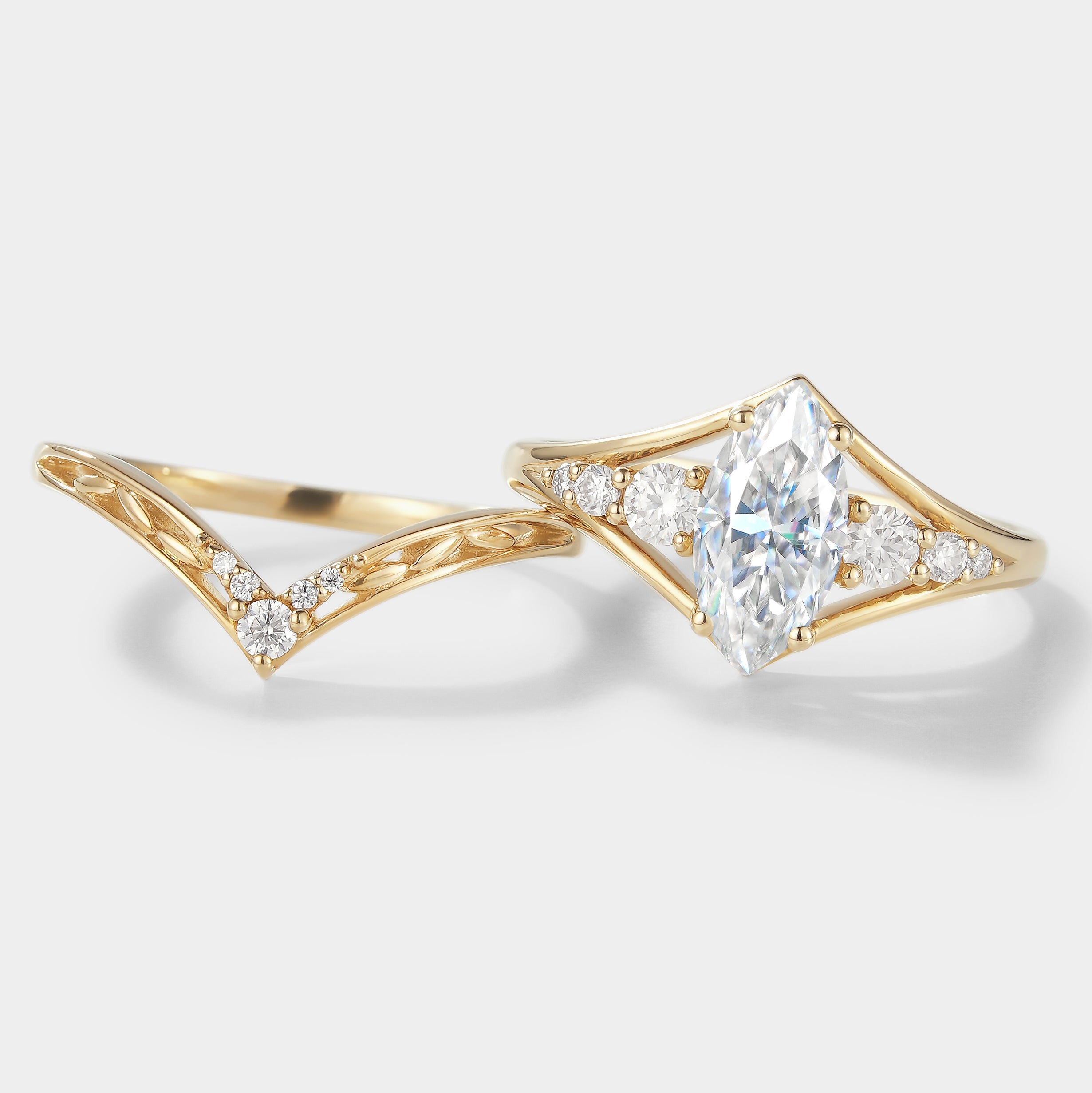 Marquise moissanite engagement ring bridal set with chevron wedding band in yellow gold. Bridal ring set.
