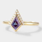 Kite-shaped alexandrite engagement ring with moissanite accents in 14k yellow gold. Vintage bridal set.