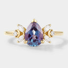 Pear cut alexandrite engagement ring with moissanite cluster, gold band, vintage design, bridal set