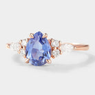 Pear cut cornflower sapphire engagement ring with moissanite accents in rose gold, bridal set.