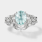 Aquamarine engagement ring set with leaf and moissanite accents
