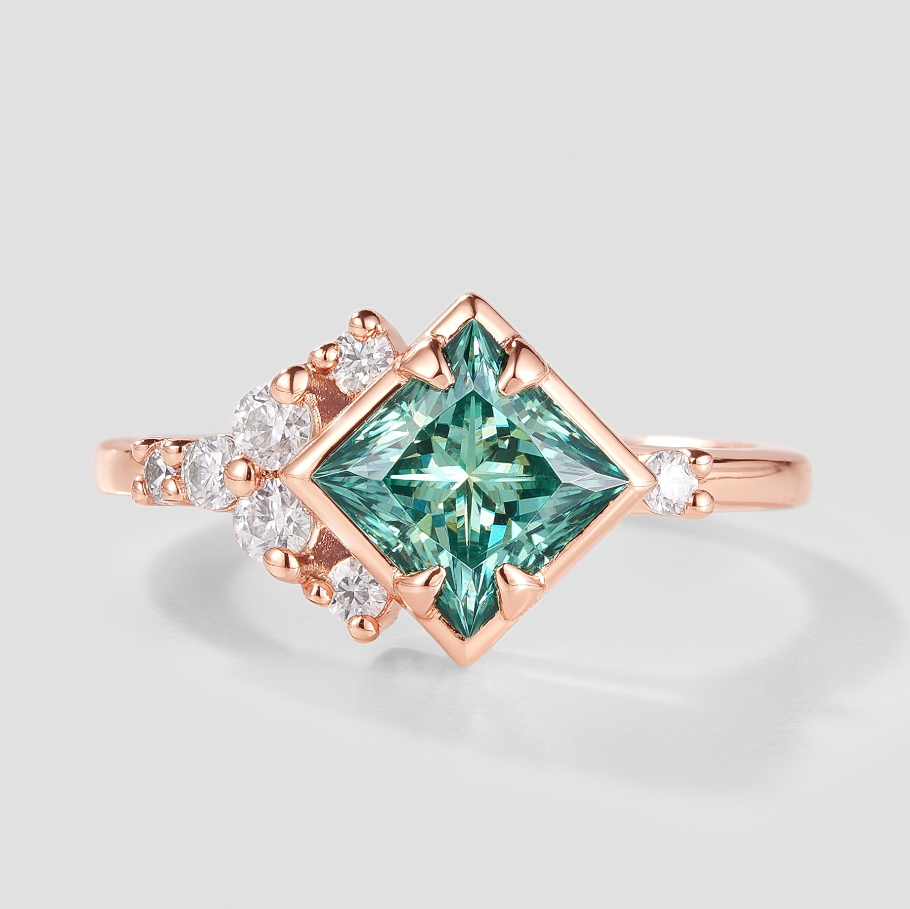 Unique princess-cut green moissanite engagement ring in rose gold
