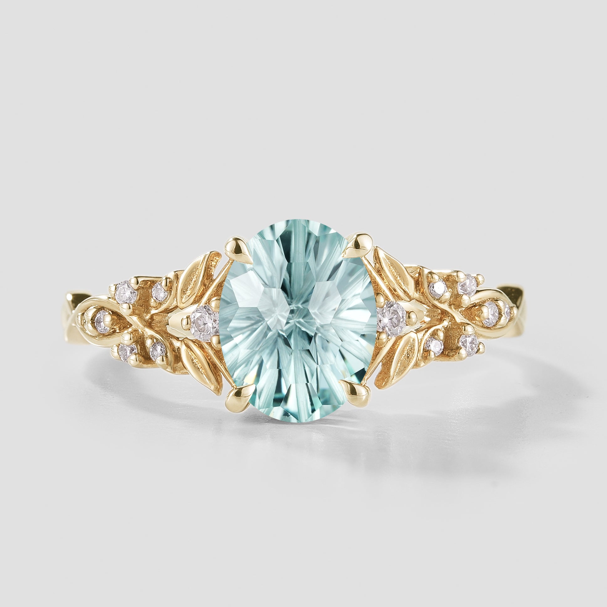 Oval Cut Aquamarine Leaf Engagement Ring In Yellow Gold