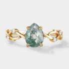 Pear cut moss agate ring with leaf design